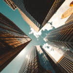 looking up at skyscrapers