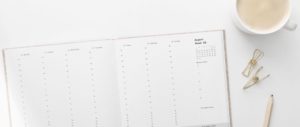 modern calendar and coffee on white table - professional mentoring program